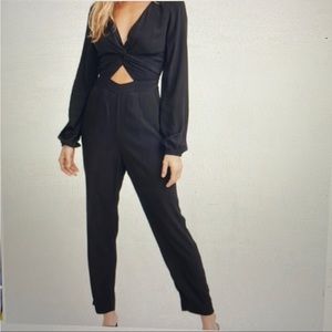 Black jumpsuit with pockets, cutout & front knot